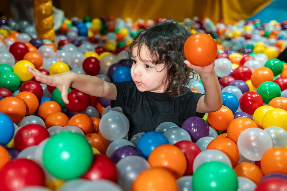 Toddler in ball pit